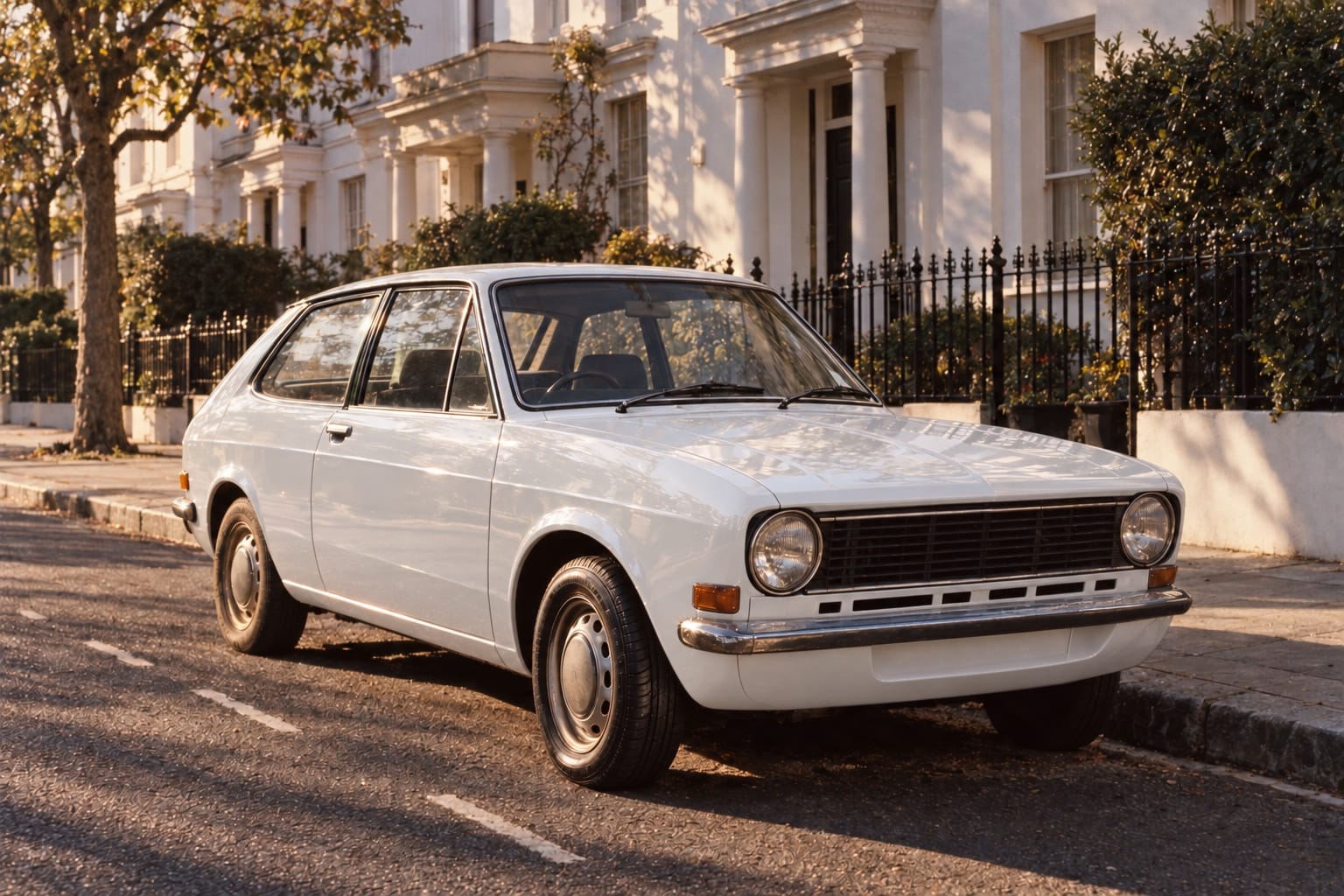 A green hatchback with a brand-new front tyre, parked on a London street